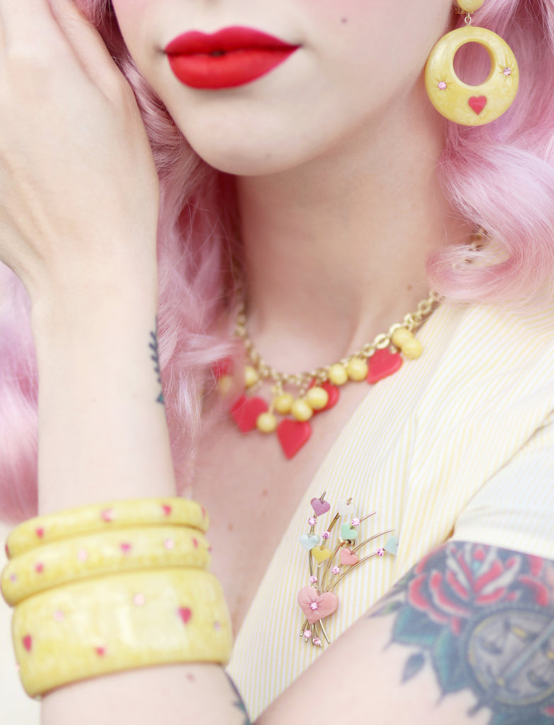 Splendette vintage inspired 1950s Valentine's style pastel yellow Honey Bunch jewellery worn by pin up model Dafna Bar-El