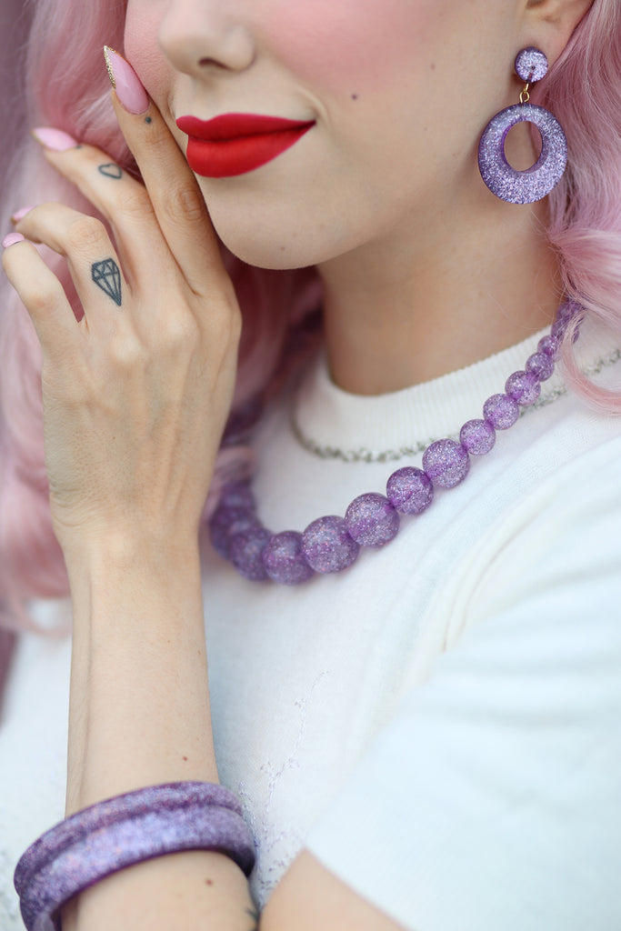 Splendette vintage inspired 1950s pin up style pastel Lilac Glitter jewellery worn by Dafna Bar-El