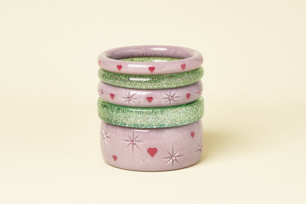 Splendette vintage inspired 1950s Valentine's style pastel purple Poppet bangles stacked with Green Lagoon glitter bangles