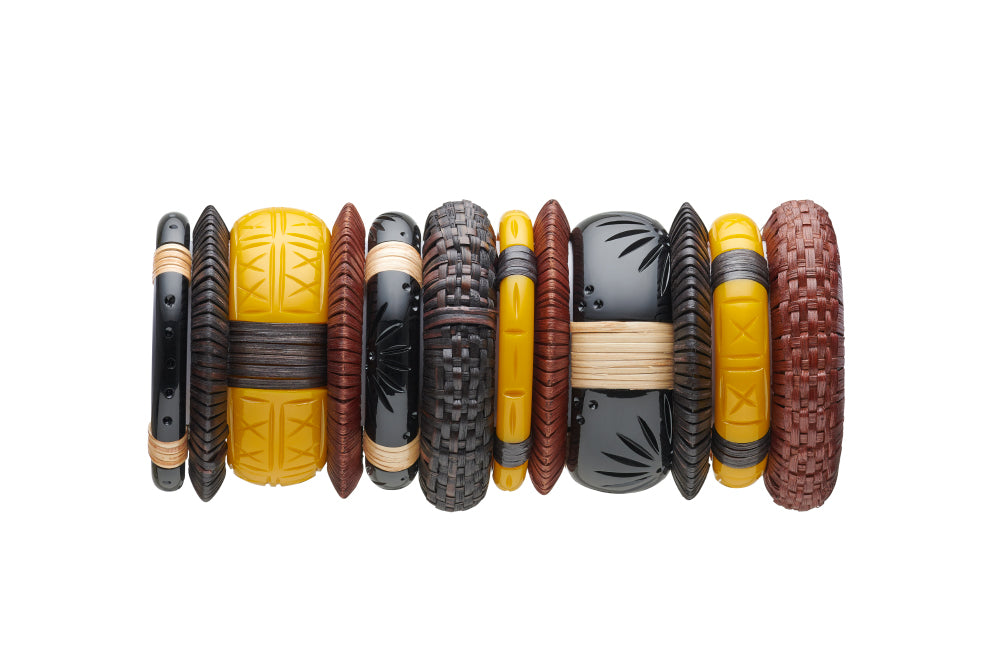 Splendette vintage inspired 1940s 1950s tropical Bakelite Style carved fakelite cane bangle stack. Dark and Mid Woven Set of Three bangles with black Panther and yellow Ochre.