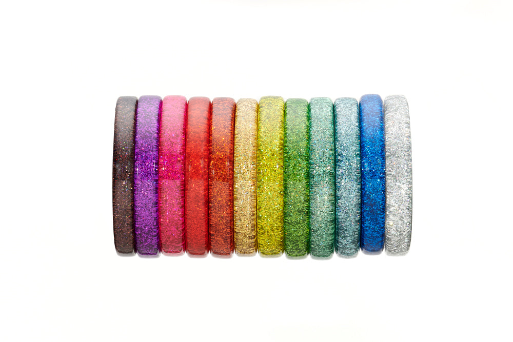 Splendette vintage inspired 1950s pin up style glitter bangles in a rainbow stack