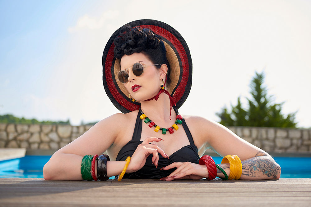 Splendette vintage inspired 1940s Bakelite style jewellery worn by a pin up model at the poolside