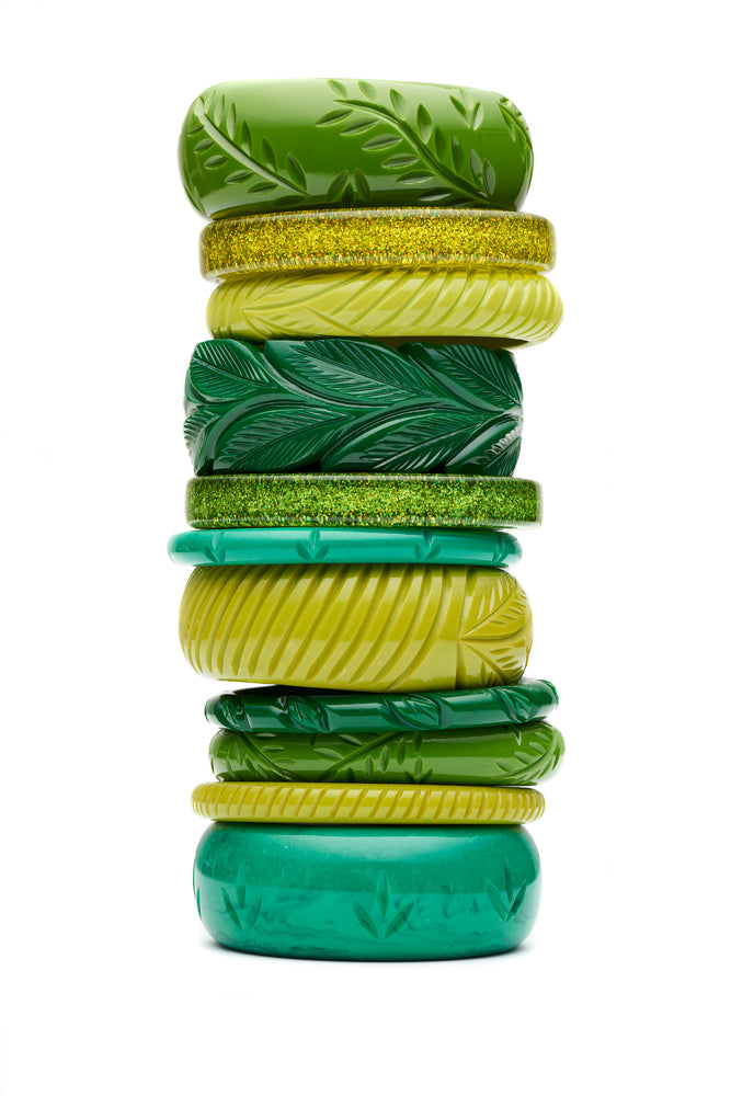 Splendette vintage inspired 1950s style stack of carved fakelite and glitter bangles in different shades of green