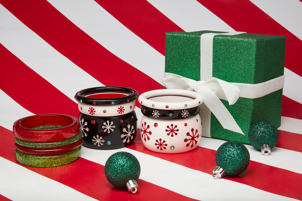 Splendette vintage inspired 1950s Christmas style Atomic Snowflake Bangle stacks with black Musta and white Lumi bangles, with red and green glitter bangle stack