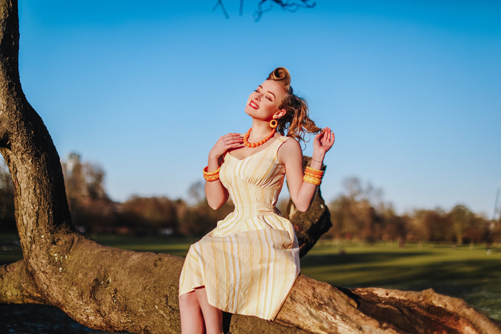 Splendette vintage inspired 1950s pin up style yellow and peachy orange carved Duotone Spring 2021 jewellery worn by Blossom & ButtercupsSplendette vintage inspired 1950s pin up style yellow and peachy orange carved Duotone Spring 2021 jewellery worn by Blossom & Buttercups