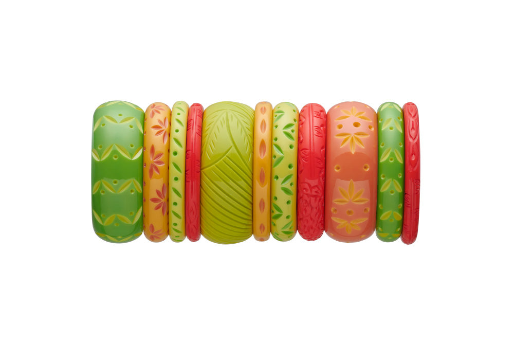 Splendette vintage inspired 1950s tropical style stack of carved fakelite bangles in green and orange. Featuring Lime, Zest, Honeysuckle, Freesia, and Coral