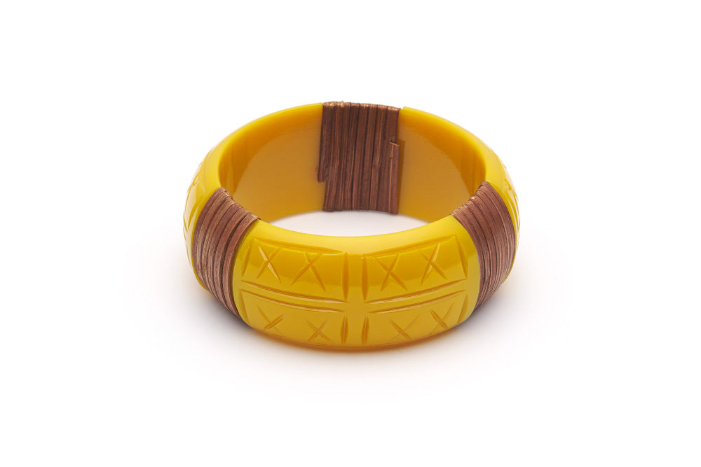 Splendette vintage inspired 1940s 1950s tropical style carved yellow fakelite Wide Ochre Mid Cane Bangle in Classic size.