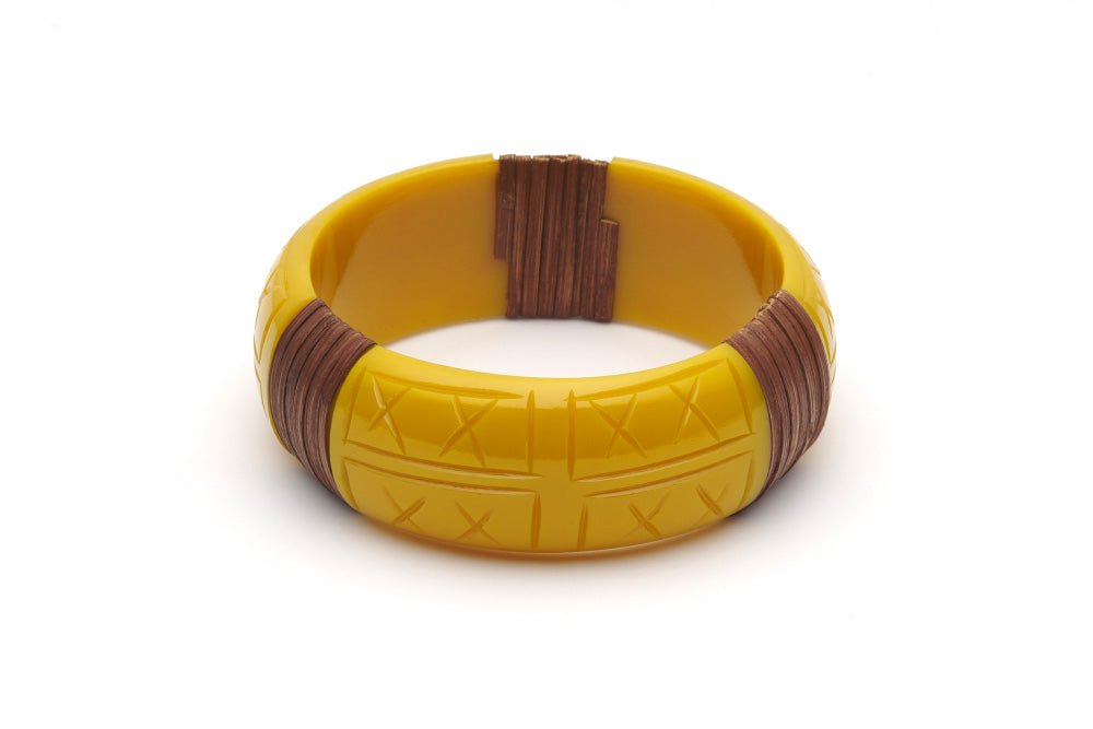 Splendette vintage inspired 1940s 1950s tropical style carved yellow fakelite Wide Ochre Mid Cane Bangle in larger Duchess size.