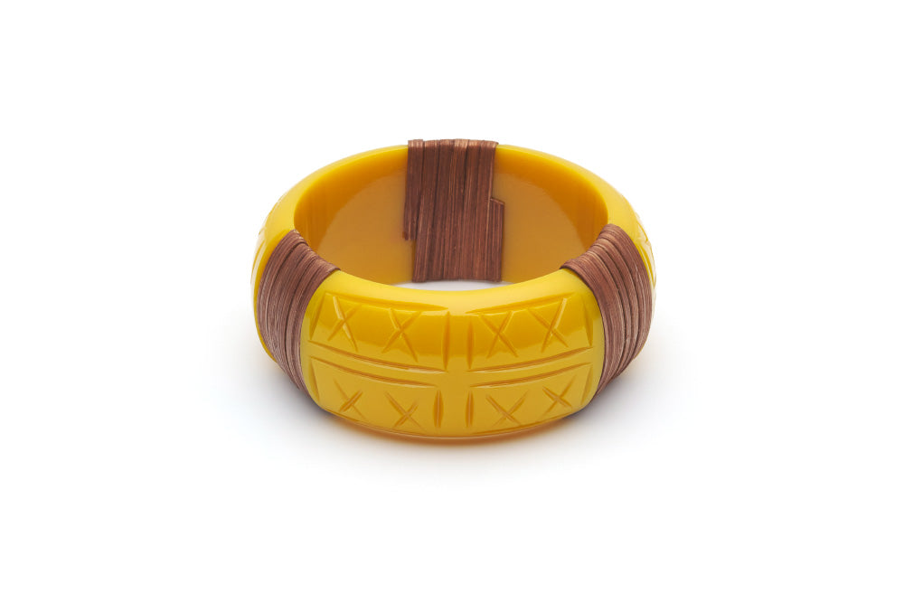 Splendette vintage inspired 1940s 1950s tropical style carved yellow fakelite Wide Ochre Mid Cane Bangle in smaller Maiden size.